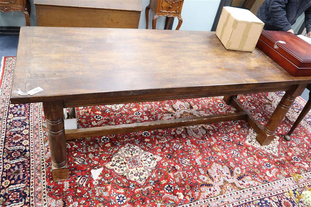 An 18th century style oak refectory dining table, width 211cm, depth 83cm, height 75cm